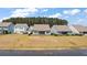 Expansive backyard view from behind the house, featuring a screened-in porch at 629 Snow Owl Dr, Summerville, SC 29486