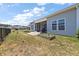 Backyard featuring a well maintained lawn, patio, and view of the pond at 629 Snow Owl Dr, Summerville, SC 29486