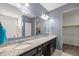 Bathroom featuring double vanity with granite countertop and a large mirror with vanity lights at 629 Snow Owl Dr, Summerville, SC 29486