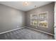 Bedroom with neutral carpet, gray walls and natural light from two large windows at 629 Snow Owl Dr, Summerville, SC 29486