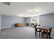 Large bonus room with grey walls, neutral carpet, and a dining area at 629 Snow Owl Dr, Summerville, SC 29486