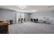 Spacious bonus room with neutral carpeting, dining table, and large window at 629 Snow Owl Dr, Summerville, SC 29486