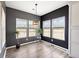 Inviting breakfast nook with gray walls, three large windows, and modern lighting at 629 Snow Owl Dr, Summerville, SC 29486