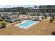 An aerial view of a community pool with lounge chairs and a well-maintained pool area at 629 Snow Owl Dr, Summerville, SC 29486