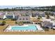 Aerial view of a community pool with ample seating and a well-maintained recreational area at 629 Snow Owl Dr, Summerville, SC 29486