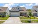 Charming single-Gathering home with a two-car garage, manicured lawn, and inviting curb appeal at 629 Snow Owl Dr, Summerville, SC 29486