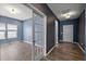 Hallway leading to a home office and front door with hard surface floors at 629 Snow Owl Dr, Summerville, SC 29486