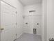 White laundry room with a shelf for storage at 629 Snow Owl Dr, Summerville, SC 29486