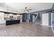 Open-concept living area showcases wood floors, a kitchen, a staircase, and blue accent walls at 629 Snow Owl Dr, Summerville, SC 29486