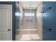 Modern shower features glass enclosure, built-in seat and niche, with multiple shower heads at 629 Snow Owl Dr, Summerville, SC 29486