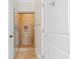 Bathroom showcasing glass shower doors and travertine tile at 656 Coleman Blvd # 405, Mount Pleasant, SC 29464