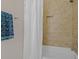 Tiled bathroom with tiled shower and tub, and a decorative towel rack at 656 Coleman Blvd # 405, Mount Pleasant, SC 29464