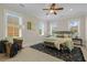 Bedroom featuring a ceiling fan, three windows, and carpet flooring at 656 Coleman Blvd # 405, Mount Pleasant, SC 29464