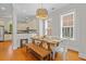 Dining room with modern light fixture, dining table and view to the kitchen at 656 Coleman Blvd # 405, Mount Pleasant, SC 29464