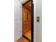 A wood-paneled elevator with black folding gate between white doors at 656 Coleman Blvd # 405, Mount Pleasant, SC 29464