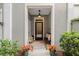 Warm and welcoming entryway with a pendant light, bench seating, and decorative potted flowers at 656 Coleman Blvd # 405, Mount Pleasant, SC 29464