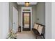Well-decorated entryway with a bench, throw pillows, stylish decor, and a clear view through the front door at 656 Coleman Blvd # 405, Mount Pleasant, SC 29464