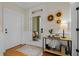 Elegant foyer with hardwood floors, white wainscoting, console table, and decorated with modern decor at 656 Coleman Blvd # 405, Mount Pleasant, SC 29464