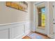 Bright hallway leading to an outdoor balcony, with detailed wall paneling at 656 Coleman Blvd # 405, Mount Pleasant, SC 29464