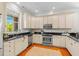 Cozy kitchen featuring granite countertops, stainless steel appliances, and ample cabinet space at 656 Coleman Blvd # 405, Mount Pleasant, SC 29464