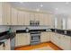 Bright kitchen featuring stainless steel appliances, granite counters, and updated fixtures at 656 Coleman Blvd # 405, Mount Pleasant, SC 29464