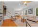 Bright living room features hardwood floors, modern furnishings, and an open floor plan to the dining area at 656 Coleman Blvd # 405, Mount Pleasant, SC 29464