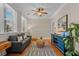 Cozy living room with hardwood floors, comfortable seating, stylish decor, and bright natural light at 656 Coleman Blvd # 405, Mount Pleasant, SC 29464