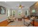 Bright living room featuring hardwood floors, stone fireplace, and comfortable seating at 656 Coleman Blvd # 405, Mount Pleasant, SC 29464