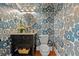 Stylish powder room featuring floral wallpaper, dark vanity and elegant lighting at 656 Coleman Blvd # 405, Mount Pleasant, SC 29464
