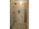 Shower featuring a niche, rain shower head, and travertine tile at 656 Coleman Blvd # 405, Mount Pleasant, SC 29464