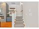 Staircase boasts stylish carpet runners, a custom stone fireplace, and convenient storage at 656 Coleman Blvd # 405, Mount Pleasant, SC 29464