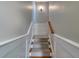 Carpeted staircase with painted risers and white trim, leading to the upper level at 656 Coleman Blvd # 405, Mount Pleasant, SC 29464