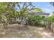 Back of home featuring a wooden deck, lush landscaping, and mature trees at 7 Sconesill Ln, Charleston, SC 29414