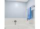Bathtub with blue towel hanging next to shower head and white tile at 7 Sconesill Ln, Charleston, SC 29414