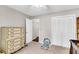 Bedroom with neutral carpet, a toy piano, and a dresser at 7 Sconesill Ln, Charleston, SC 29414