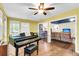 Bonus room featuring a piano and view to the kitchen and living room at 7 Sconesill Ln, Charleston, SC 29414