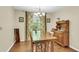 Inviting dining room with natural light and hardwood flooring at 7 Sconesill Ln, Charleston, SC 29414