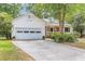 Charming single-Gathering home with a two-car garage, well-maintained lawn, and mature trees, offering curb appeal at 7 Sconesill Ln, Charleston, SC 29414