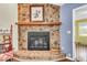 Attractive stone fireplace with a wooden mantel and hearth, creating a cozy focal point at 7 Sconesill Ln, Charleston, SC 29414