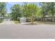 Street view of charming home with two-car garage and manicured lawn at 7 Sconesill Ln, Charleston, SC 29414