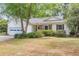Charming single-Gathering home featuring a two-car garage, brick accents, and a well-maintained front yard at 7 Sconesill Ln, Charleston, SC 29414