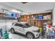 Spacious garage with storage racks, utility ladders, and a white SUV at 7 Sconesill Ln, Charleston, SC 29414