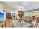 Spacious living room featuring hardwood floors, a stone fireplace, and a comfortable seating area at 7 Sconesill Ln, Charleston, SC 29414