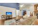 Bright and open living room with hardwood floors, a stone fireplace, and ample seating at 7 Sconesill Ln, Charleston, SC 29414