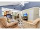 Cozy living room featuring an open layout with hardwood floors, a stone fireplace, and comfortable furnishings at 7 Sconesill Ln, Charleston, SC 29414