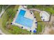 Aerial view of the community swimming pool, with lounge chairs and umbrellas surrounding the area at 7 Sconesill Ln, Charleston, SC 29414