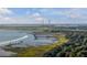 Expansive aerial view of the coastline with bridge and waterway, showcasing the natural beauty of the region at 707 Royall Ave, Mount Pleasant, SC 29464