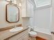 Bright bathroom featuring a granite vanity top, white fixtures, and a shower/tub combination at 707 Royall Ave, Mount Pleasant, SC 29464
