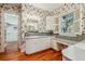 Elegant bathroom with floral wallpaper, custom vanity, and ample natural light at 707 Royall Ave, Mount Pleasant, SC 29464