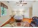 Charming bedroom with hardwood floors, a ceiling fan, and classic furniture at 707 Royall Ave, Mount Pleasant, SC 29464